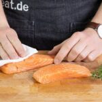 A bowl of homemade salmon cat food with sweet potatoes and peas